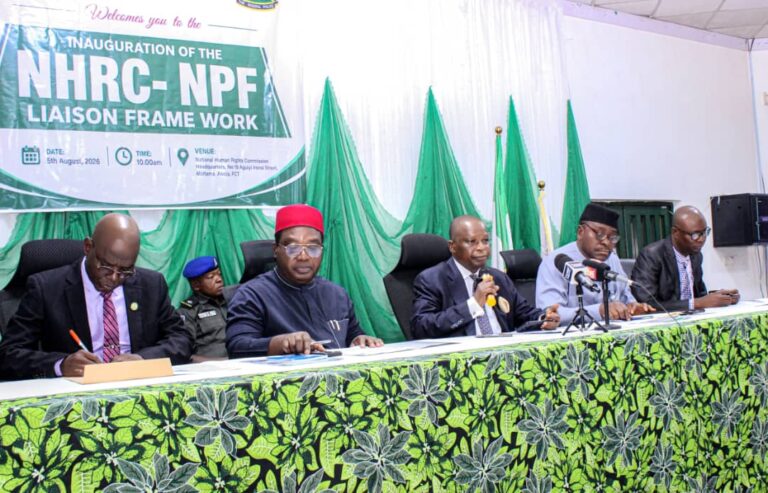 NHRC and justice officials at a formal event